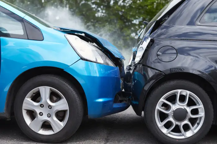 Close Up Of Two Cars Damaged In Road Traffic Accident; $2.325 Million Settlement Reached for Woman in Car Accident