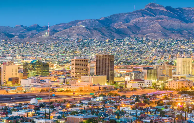 El Paso, Texas, USA downtown city skyline at dusk with Juarez, Mexico in the distance.