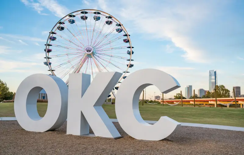 Skyline of Oklahoma City, OK with OKC sign and ferris wheel