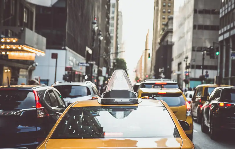 Yellow cabs in New york city. Close up of the back of a yellow cab.