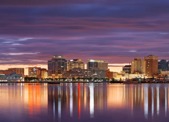 Norfolk, Virginia, USA downtown skyline on the Elizabeth River in the morning.